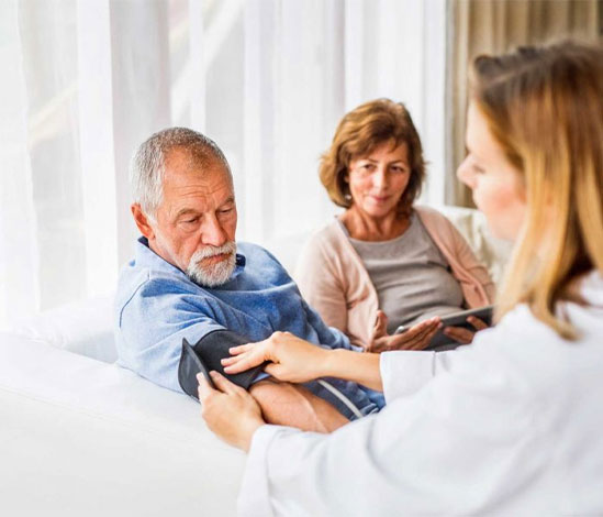 doctor checking patient blood pressure